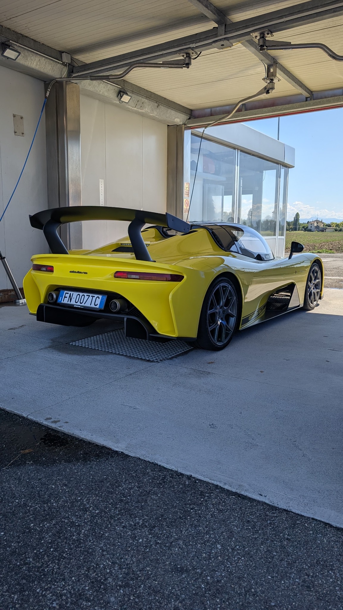 Rear three-quarter view of yellow Dallara Stradale Chassis #007
